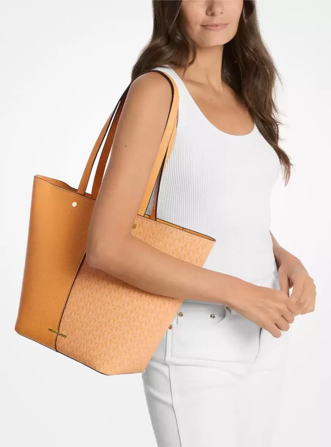 Flora Große Tragetasche aus Leder mit charakteristischem Logo