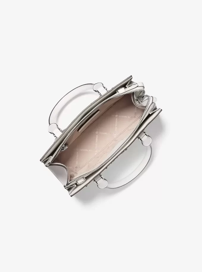 Sheila Small Schultertasche mit Nieten, Patchworkmuster und Logo