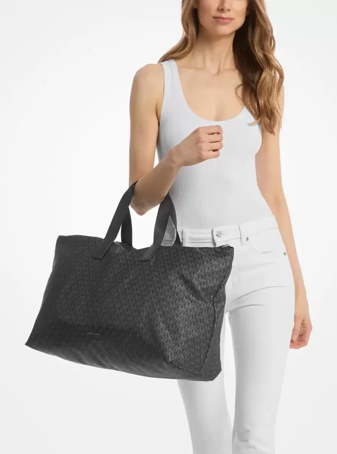 Tanner Große, bedruckte, wendbare und faltbare Tragetasche mit Logo